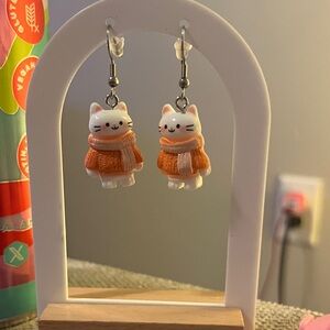 Cat Dangle Earrings in Orange Sweaters